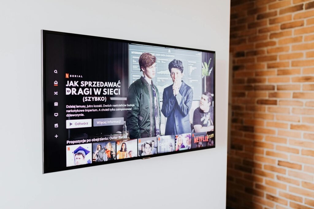 Modern living room with smart TV showing IPTV streaming interface, Switzerland flag in background, professional setup