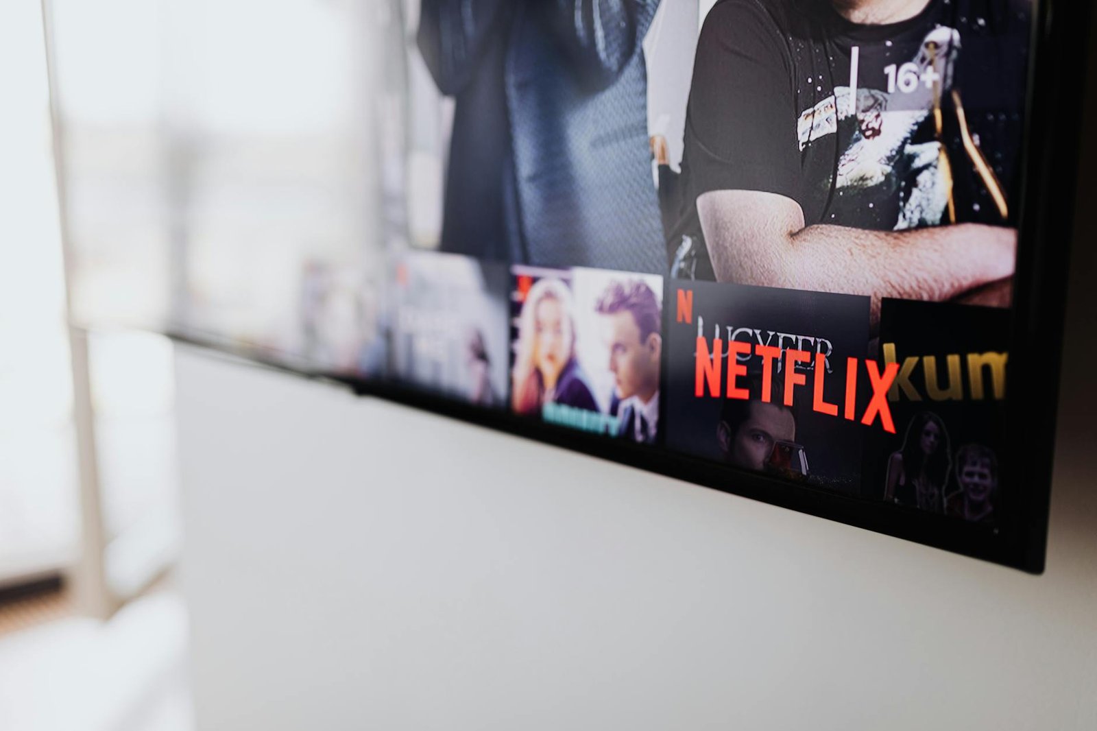 Professional IPTV streaming service comparison interface with multiple TV channels and subscription options on digital screen